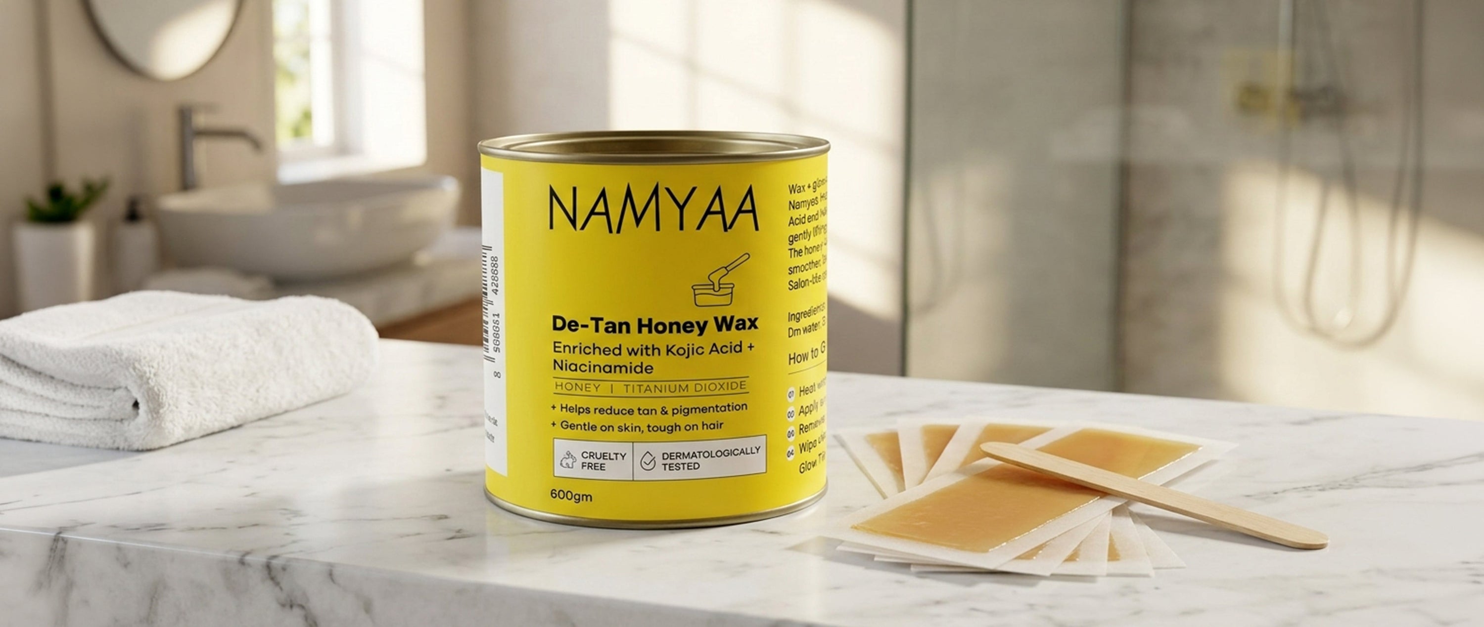  Namyaa De-Tan Honey Wax jar and strips on bathroom counter — best honey wax for beginners at home