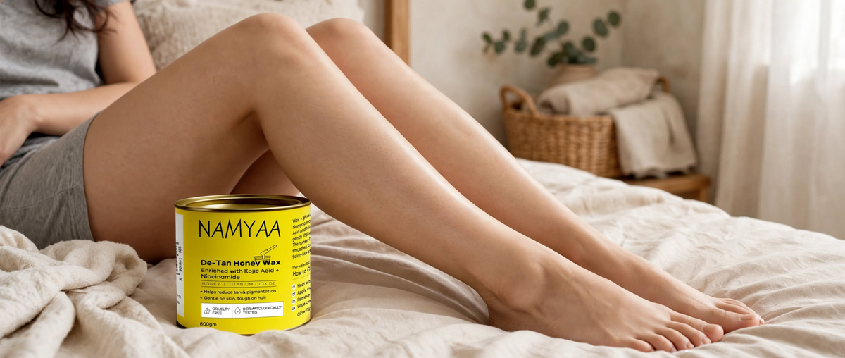 Namyaa De-Tan Honey Wax tin enriched with Kojic Acid and Niacinamide for smooth, hair-free legs.