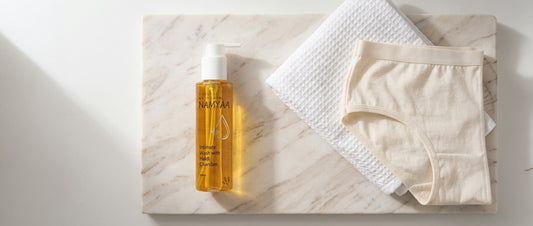 intimate hygiene after workout — pH-balanced intimate wash, clean towel, and cotton underwear for post-exercise routine