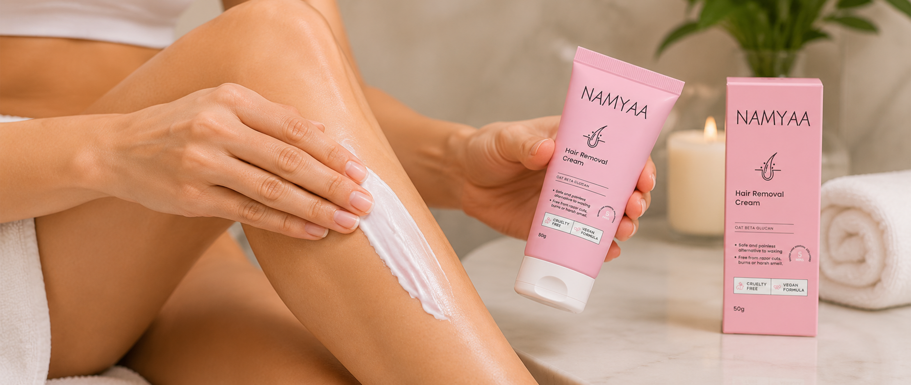 A woman applying Namyaa Hair Removal Cream on her leg next to the product tube and outer box package.