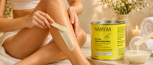 Woman applying creamy Namyaa De-Tan Liposoluble Wax enriched with Kojic Acid and Niacinamide for tan removal
