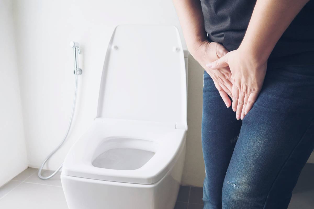 Girl is using public toilet