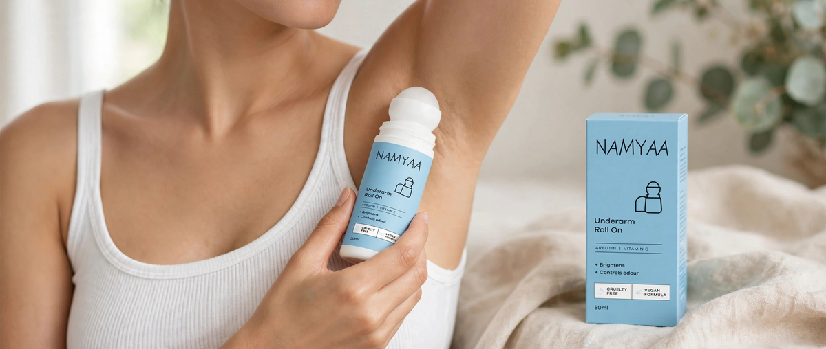 Namyaa Underarm Roll On with Arbutin and Vitamin C applied on underarm with product box