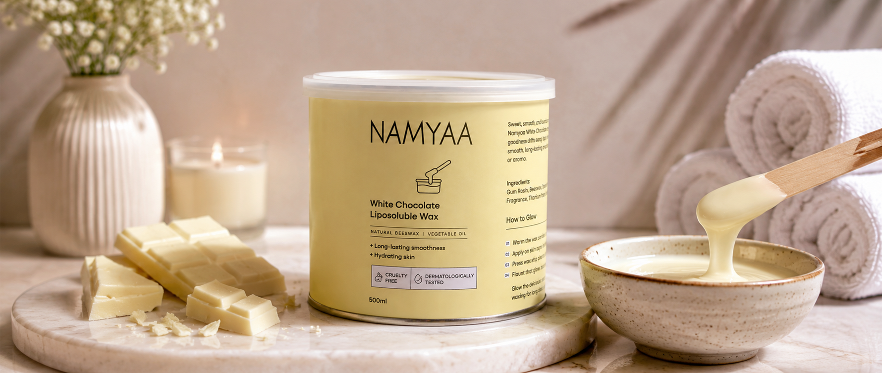 500ml Namyaa White Chocolate Liposoluble Wax tin displayed with creamy wax and wooden spatula for long lasting smoothness